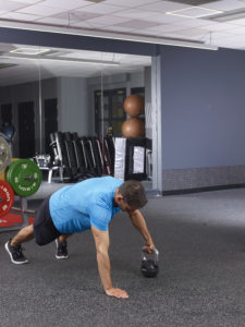 Dumbbell plank drag technique