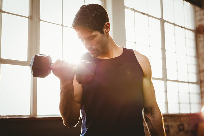 Use the dumbbell bicep curl to build big and strong arms