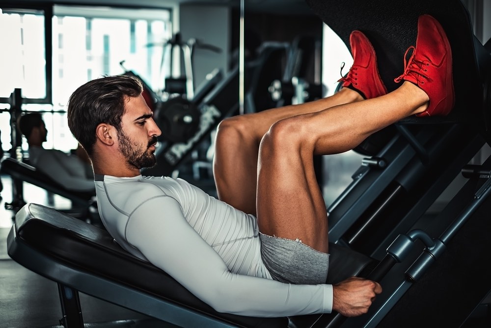 muscle man gym training leg press machine strength quads hamstrings hypertrophy