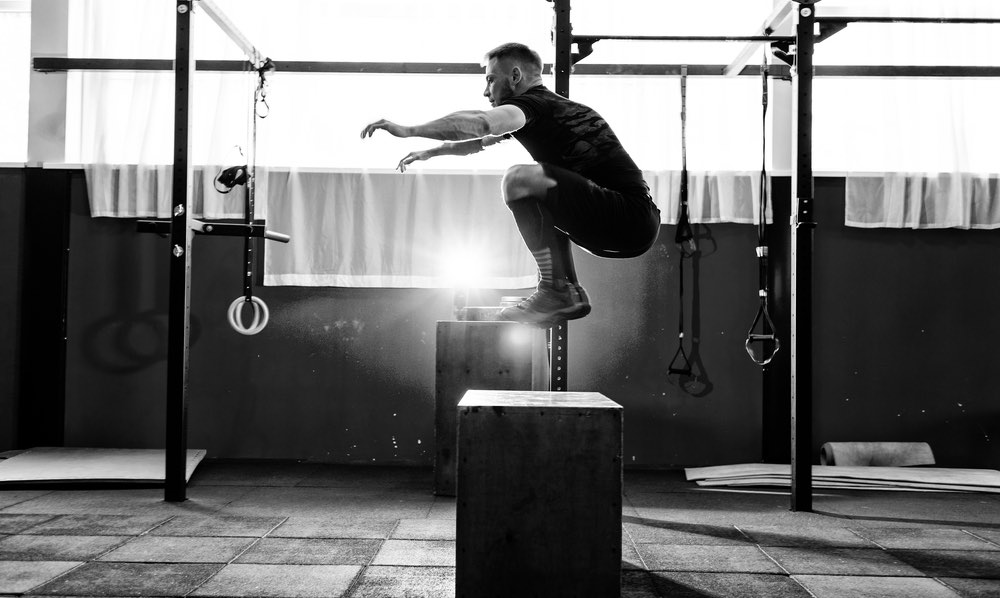 box jumps plyometric training man gym workout speed power muscle jumping